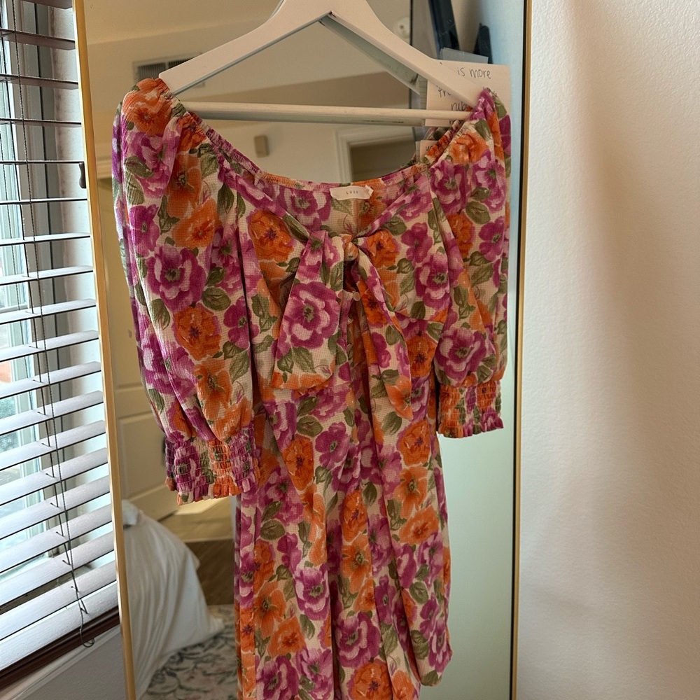 Lush Floral Romper with Pink and Orange Blooms